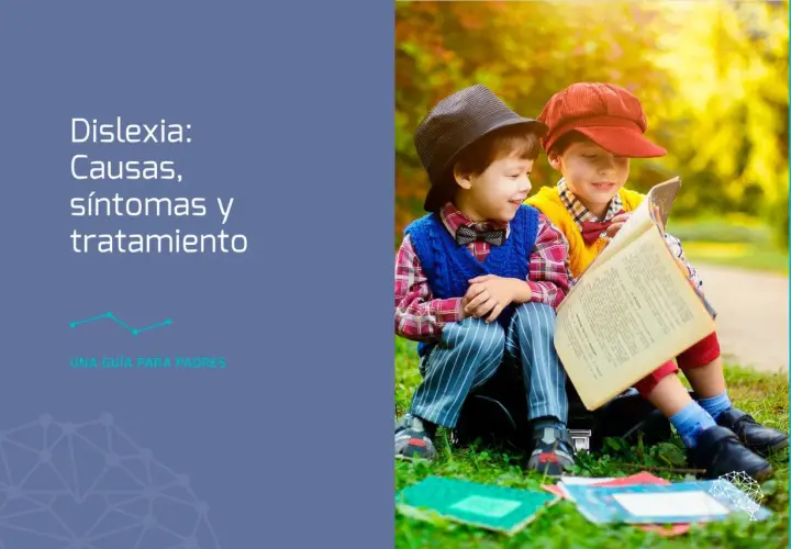 Dos niños leyendo un libro, uno con sombrero negro y otro con gorra roja. Una guía para padres sobre dislexia.