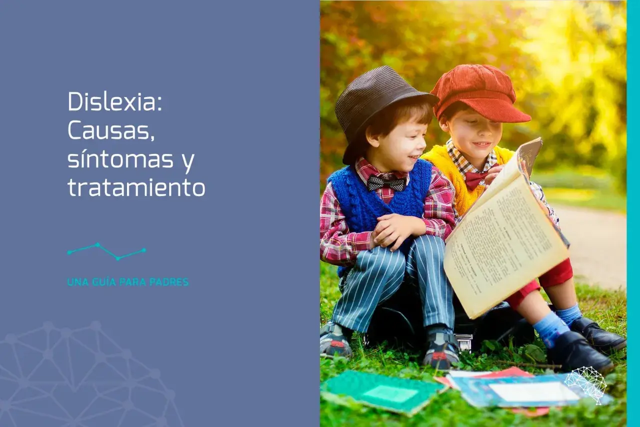 Dos niños leyendo un libro, uno con sombrero negro y otro con gorra roja. Una guía para padres sobre dislexia.